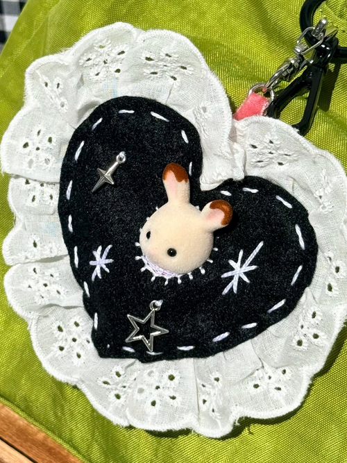 Black Felt Heart Eyelet Trim Lace Pouch with Surprise Figure